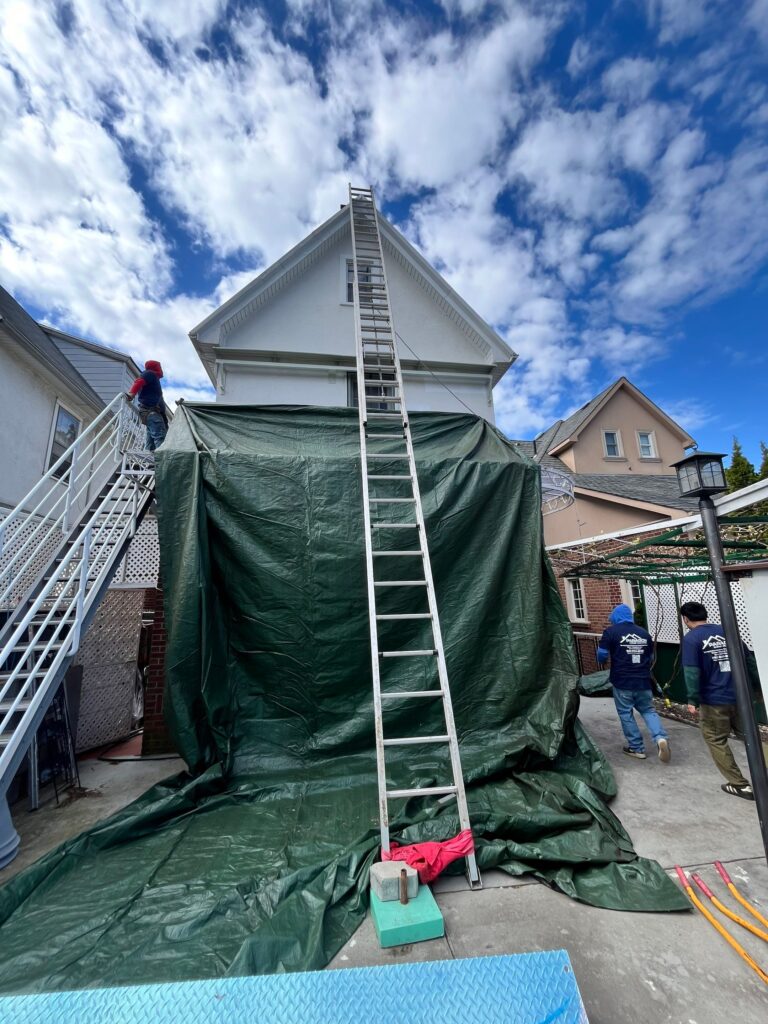 Roof repair underway by Hunts Point Roofing professionals