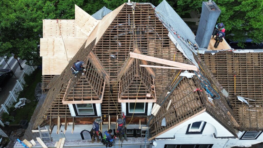 Roofers from SoHo Roofing engaged in a roof installation project