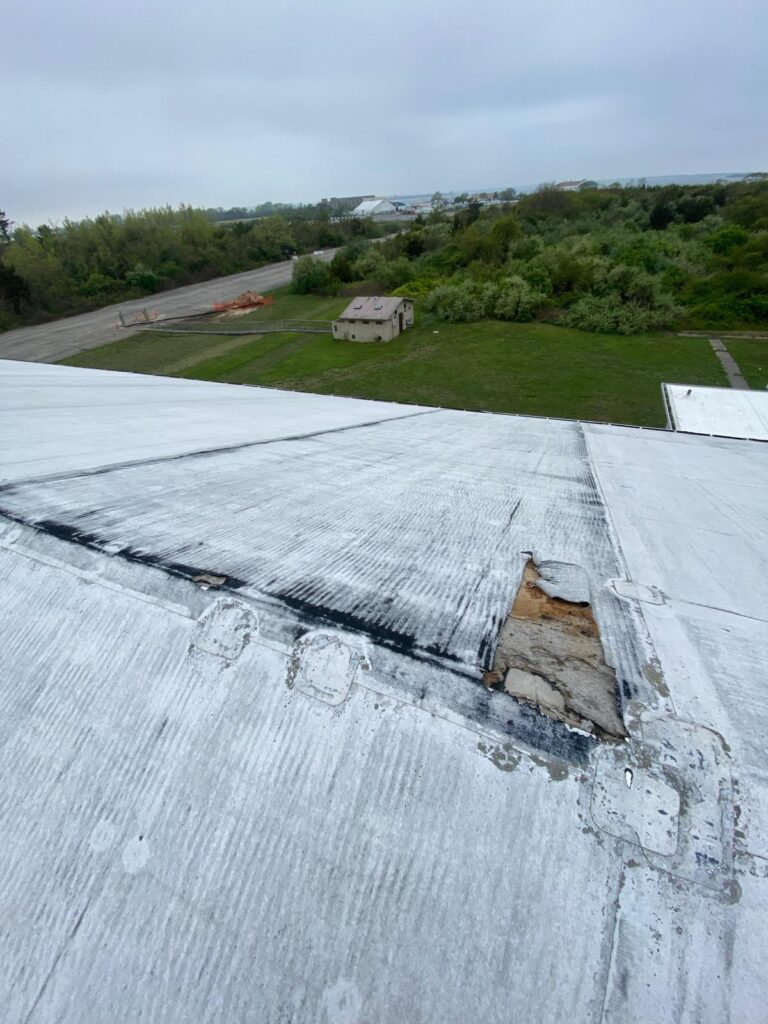 Roofers from Morrisania Roofing performing a roof repair