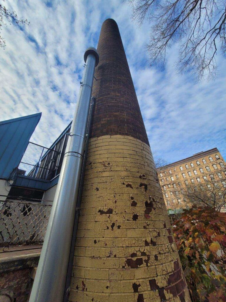 Chimney service being conducted by Staten Island Roofing experts